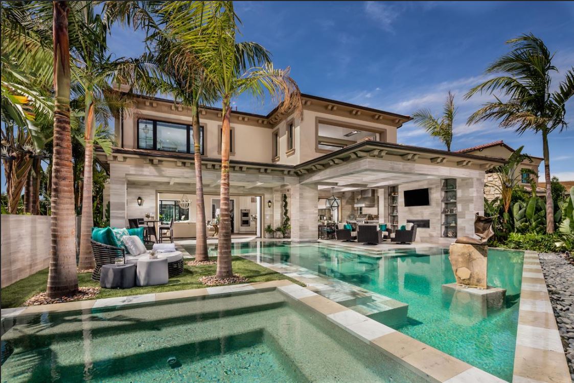 Luxury home with pools, wide glass windows, and pocket doors